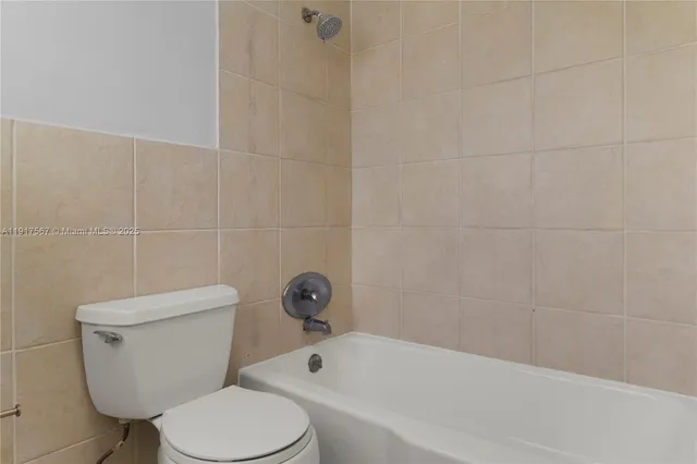 a white toilet and a shower