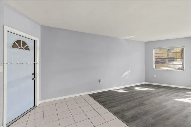 a view of an empty room with window