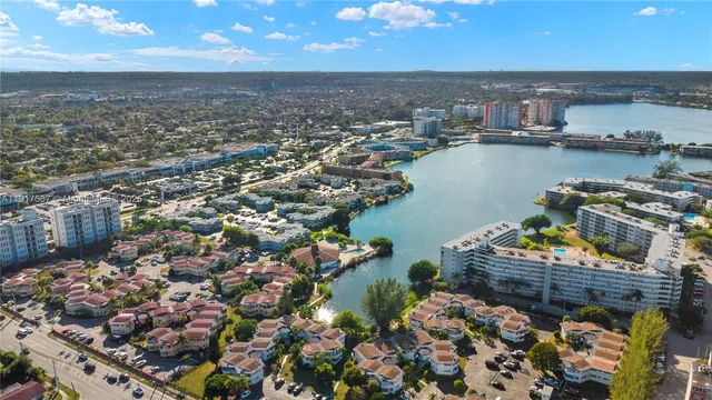 an aerial view of a house with a lake view