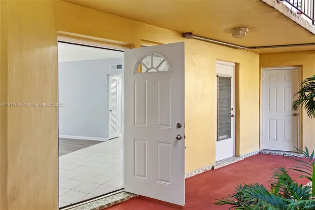 a view of front door and bedroom