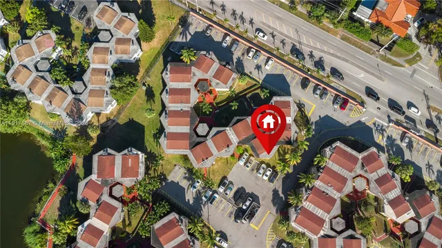 an aerial view of residential house with outdoor space and swimming pool