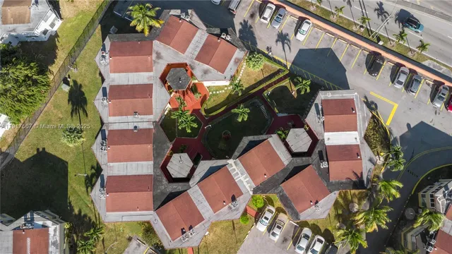 an aerial view of a houses with yard