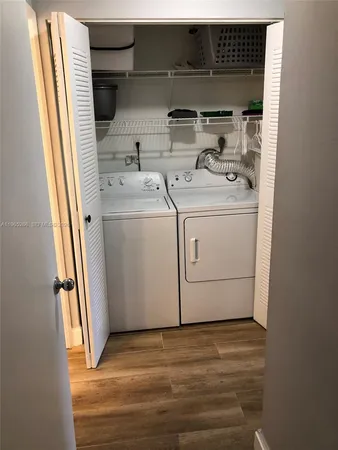 a view of a bathroom with wooden floor