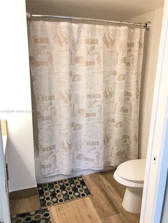 a bathroom with a sink a mirror and a shower