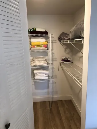 a spacious bedroom with a bed and a table