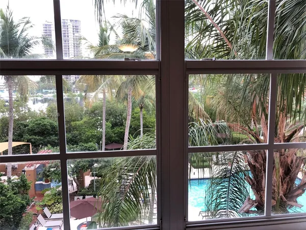 a view of balcony with wooden floor and fence
