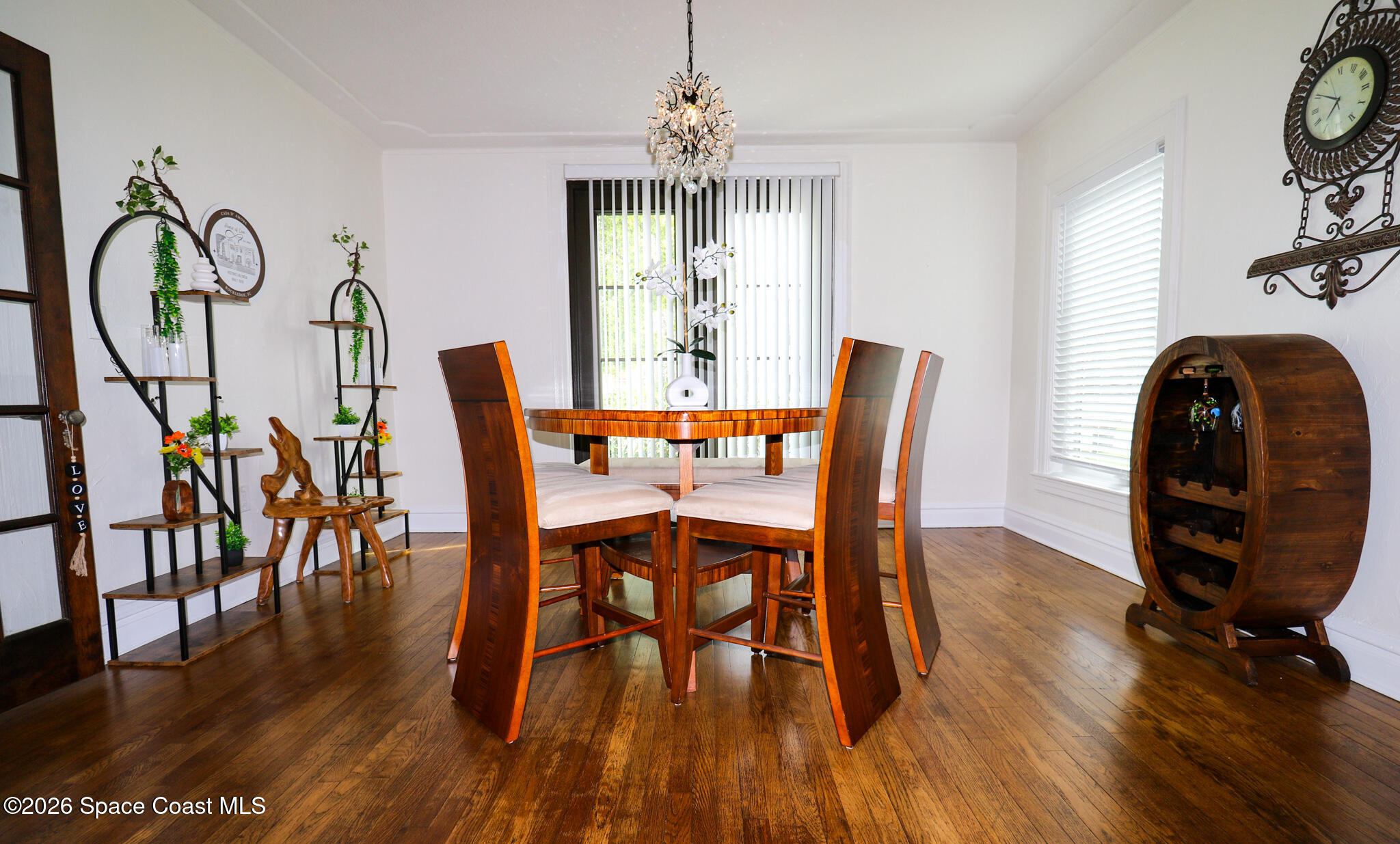 130 Valencia Road Rockledge, FL 32955 - Photo 30 of 72 a dining room with furniture potted plants and wooden floor