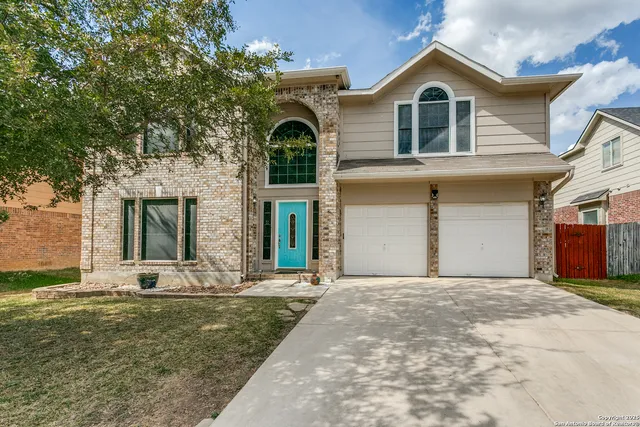 a front view of a house with yard