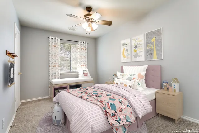 a bedroom with a large bed and a window