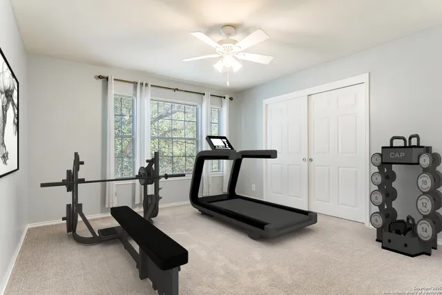 a room with gym equipment and a large window