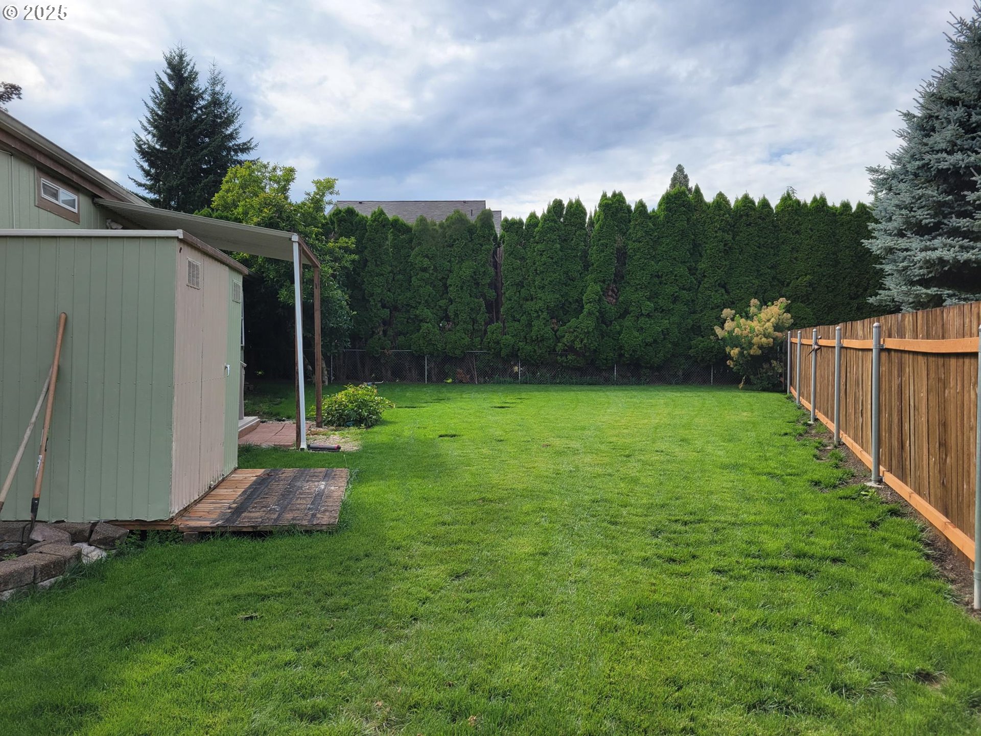 50551 Bark Way, Unit 47 Scappoose, OR 97056 - Photo 15 of 21 a view of a backyard with a small cabin