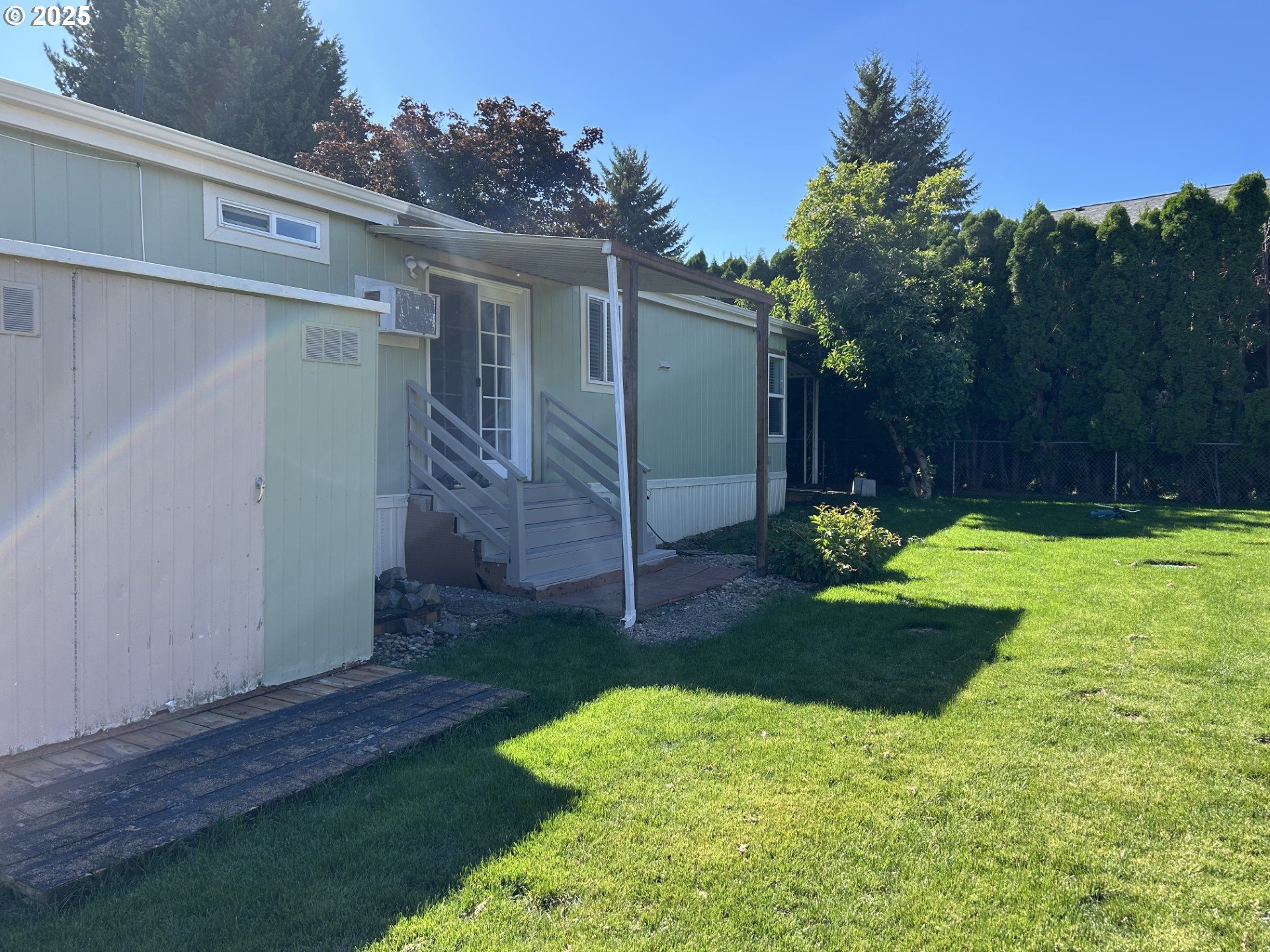 50551 Bark Way, Unit 47 Scappoose, OR 97056 - Photo 19 of 21 a view of a backyard with a garden