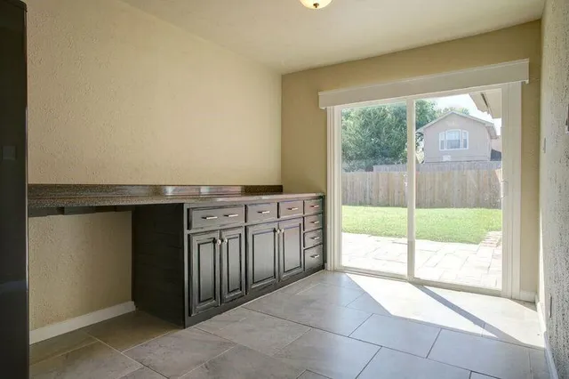 a kitchen with a sink and a large window