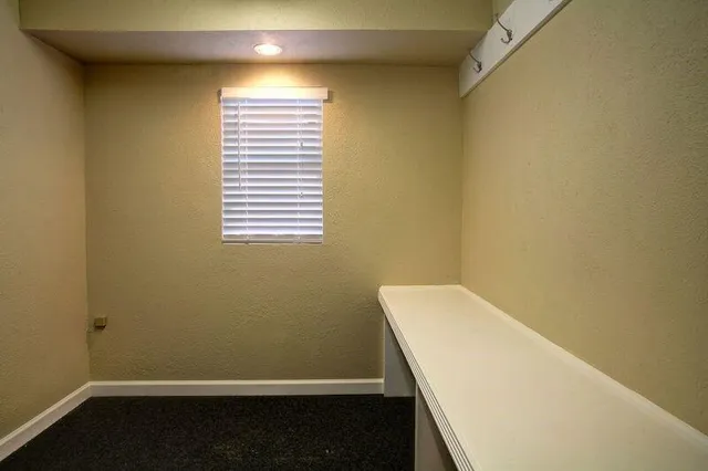 a view of a room that has a window in it