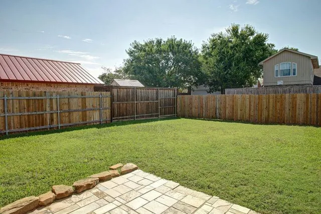 a view of a backyard with a garden