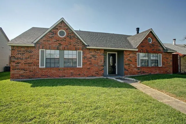 front view of a house with a yard