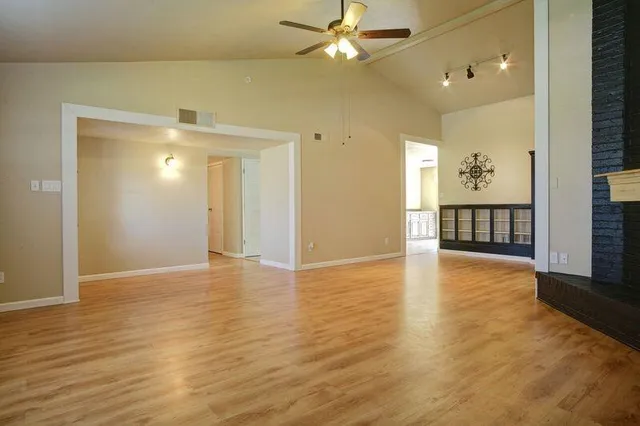 a view of a livingroom with wooden floor
