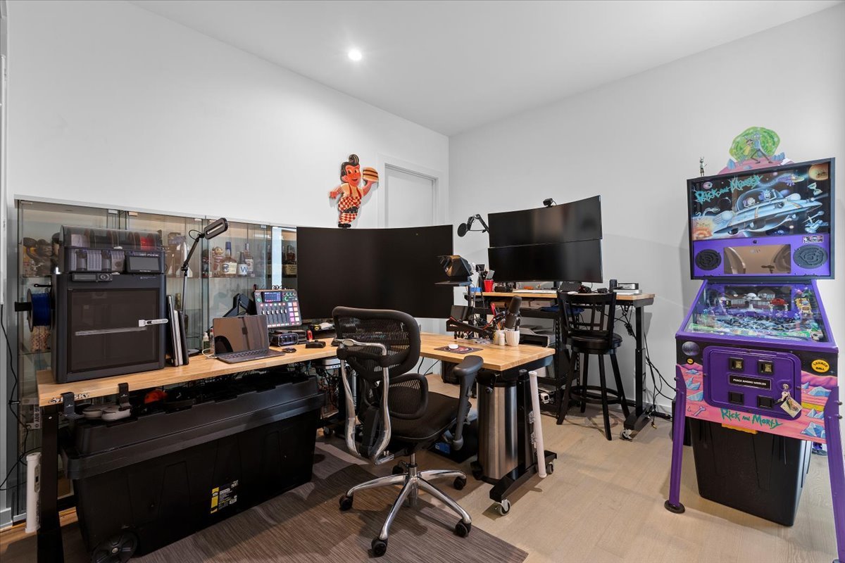 2773 North Hampden Court, Unit PH03 Chicago, IL 60614 - Photo 13 of 37 a view of a workspace with furniture and a flat screen tv