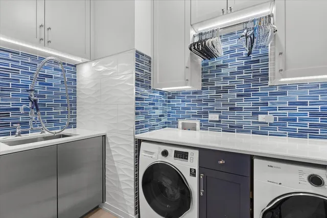 a view of a storage utility room with washer and dryer