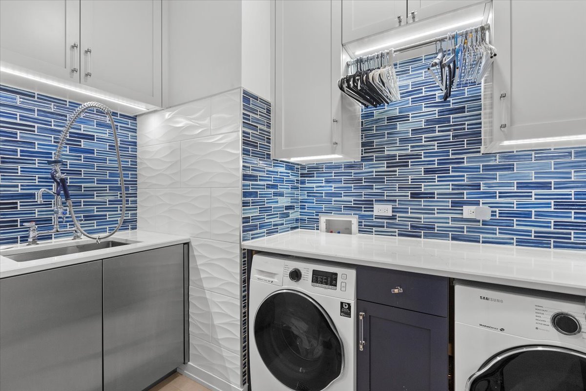 2773 North Hampden Court, Unit PH03 Chicago, IL 60614 - Photo 14 of 37 a view of a storage utility room with washer and dryer