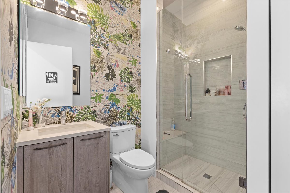 2773 North Hampden Court, Unit PH03 Chicago, IL 60614 - Photo 16 of 37 a bathroom with a sink toilet and shower