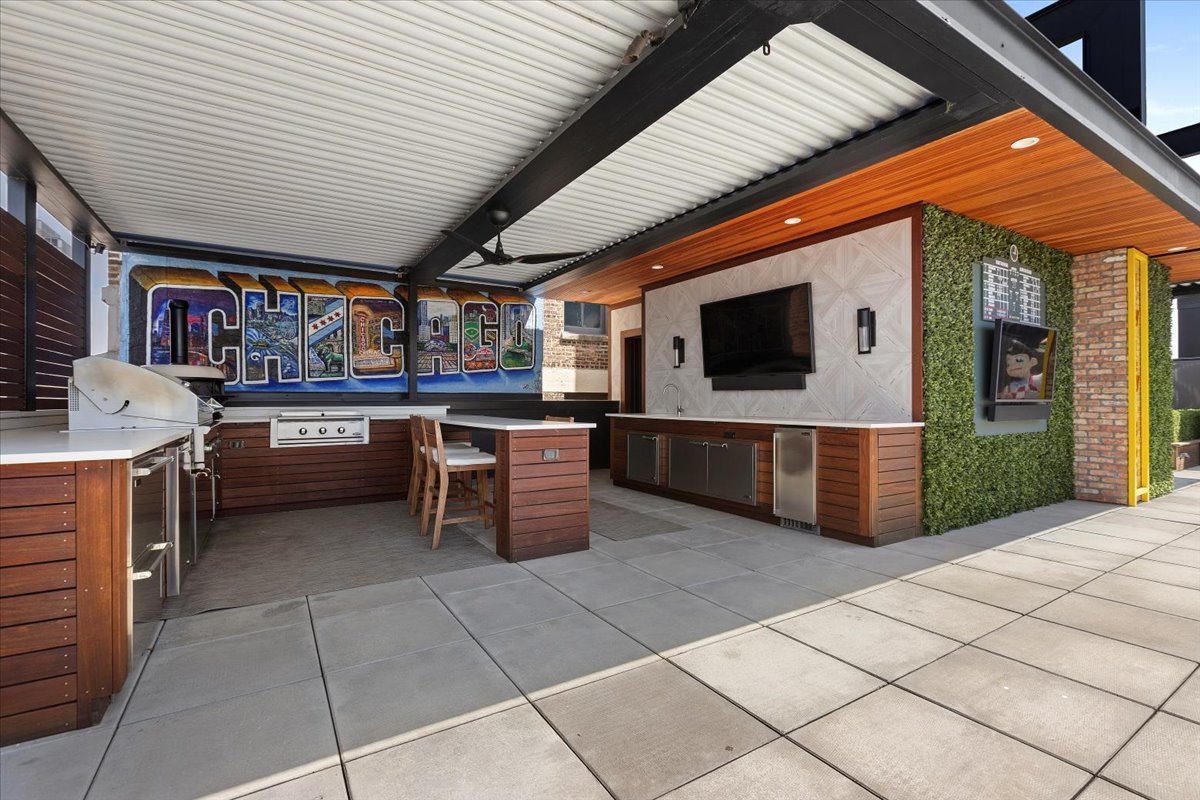 2773 North Hampden Court, Unit PH03 Chicago, IL 60614 - Photo 21 of 37 a open kitchen with stainless steel appliances granite countertop a sink and cabinets