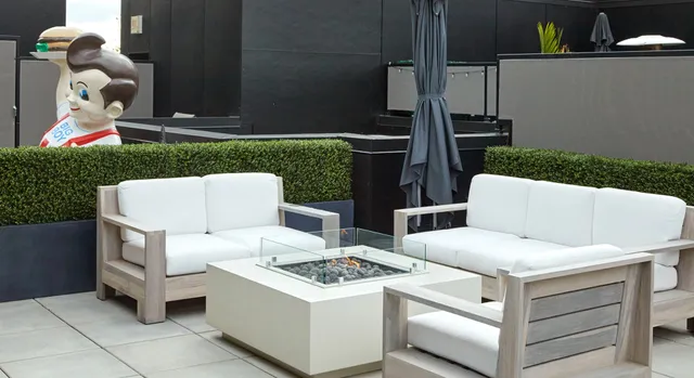 a outdoor space with patio fireplace and furniture