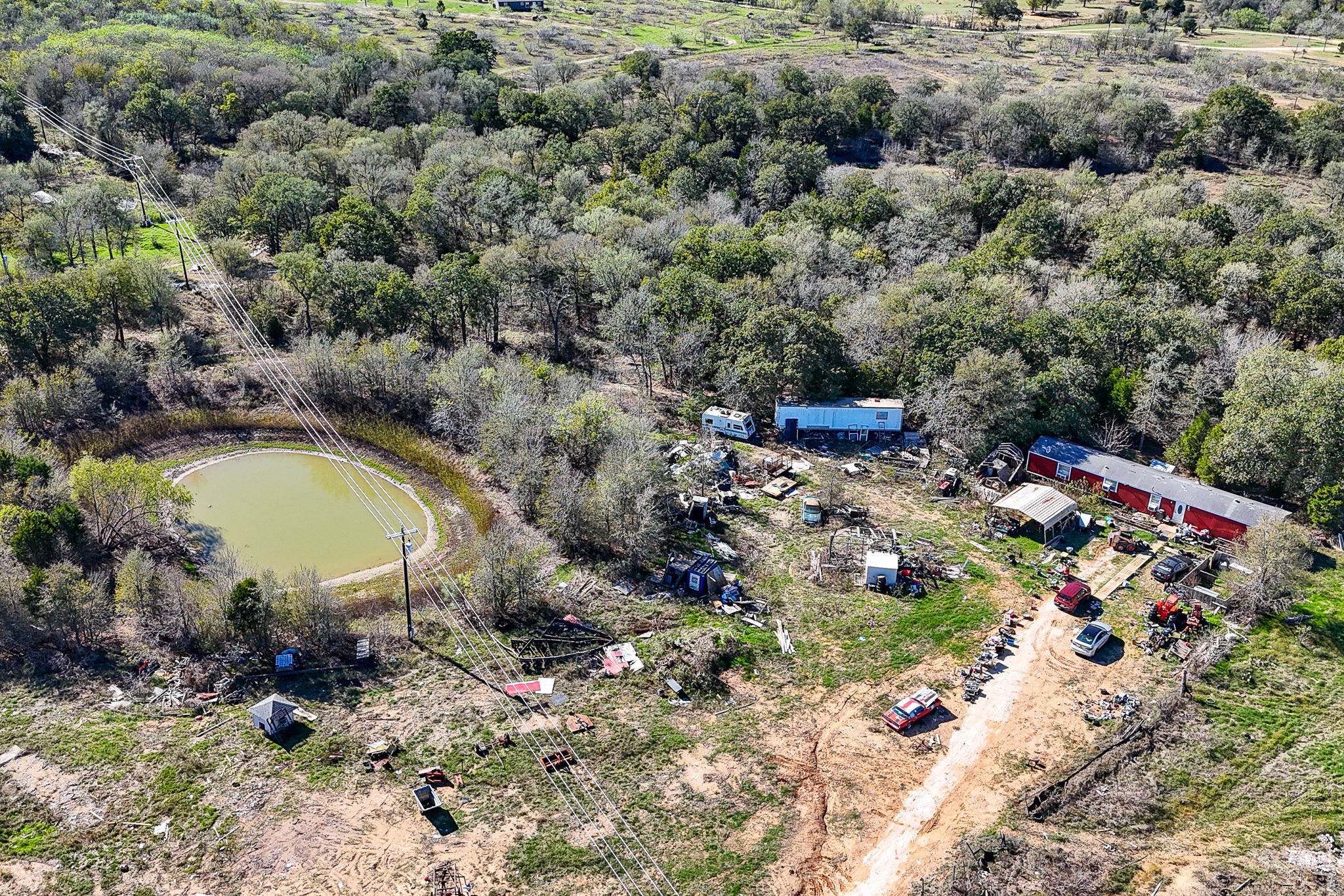166 Norwood Lane Elgin, TX 78621 - Photo 15 of 22 a aerial view of a house with a yard and lake view