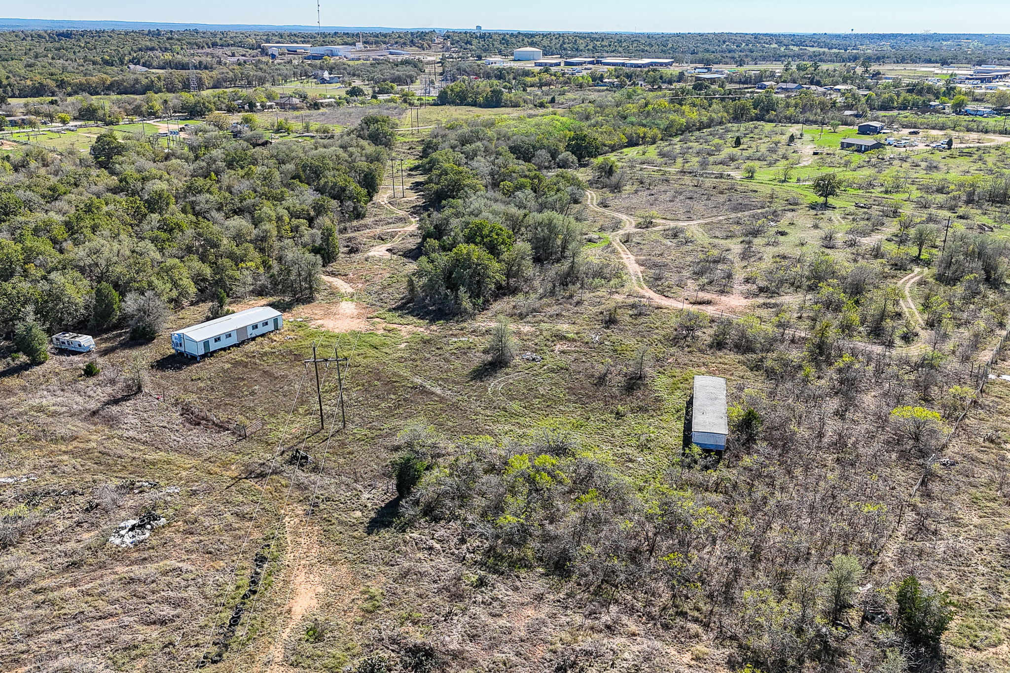 166 Norwood Lane Elgin, TX 78621 - Photo 19 of 22 an aerial view of residential houses with outdoor space