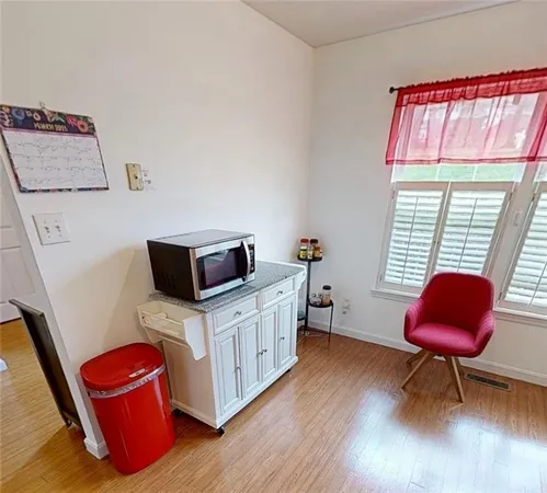 a spacious bedroom with a bed and a chair