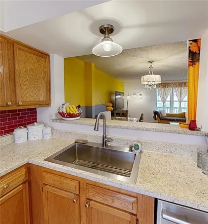 a kitchen with a sink and a window