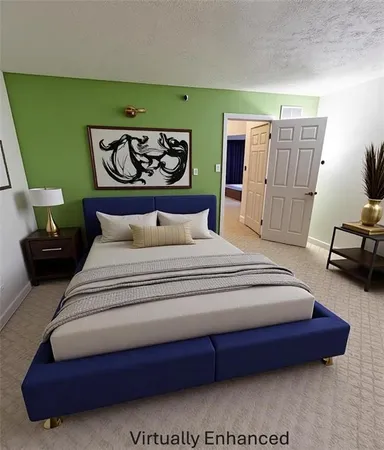 a bedroom with a bed and a refrigerator