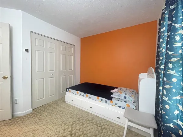 a bedroom with a bed