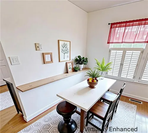 a dining room with furniture and window