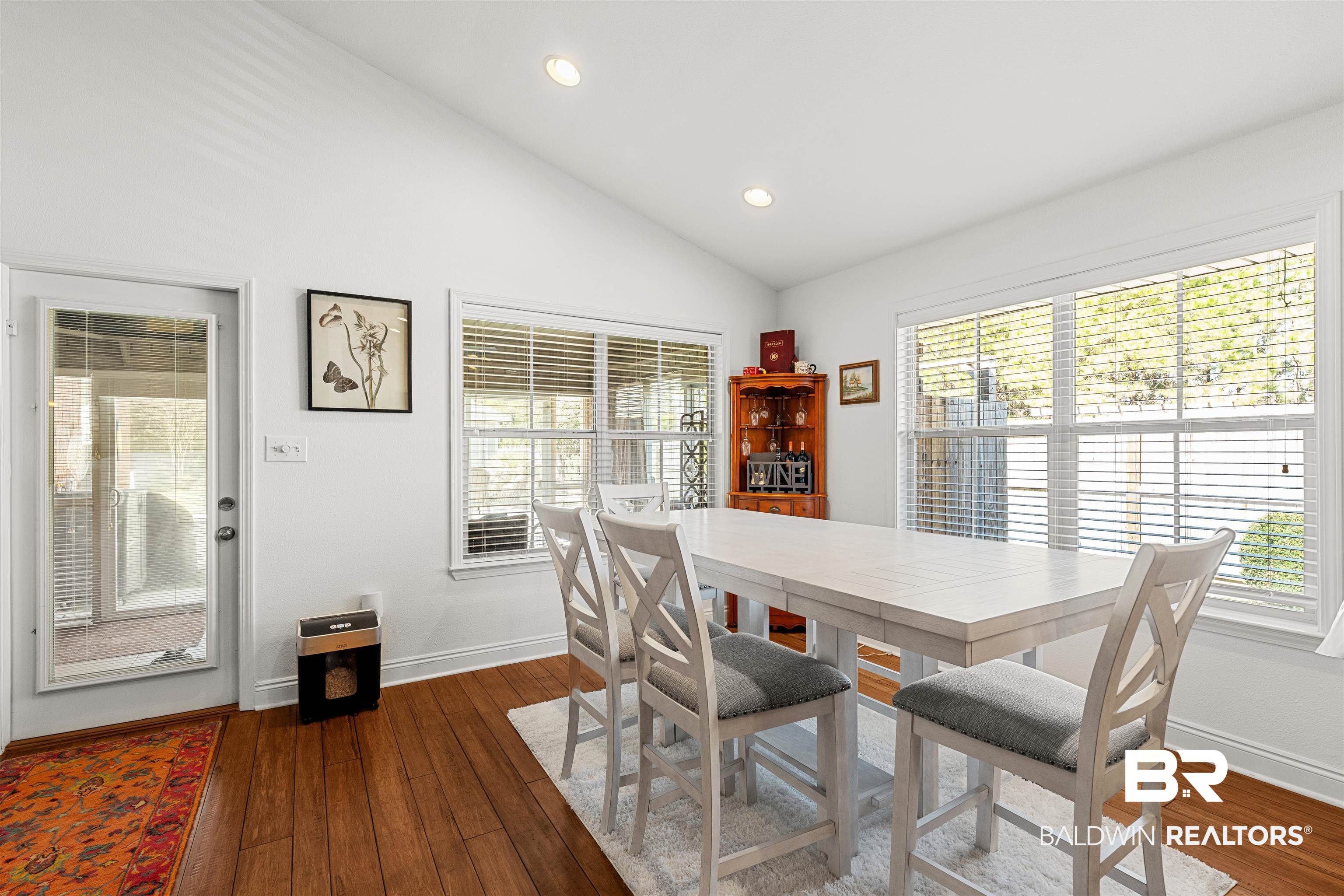 1850 Arcadia Drive Foley, AL 36535 - Photo 17 of 44 Dining space with vaulted ceiling, dark wood-type flooring, and baseboards