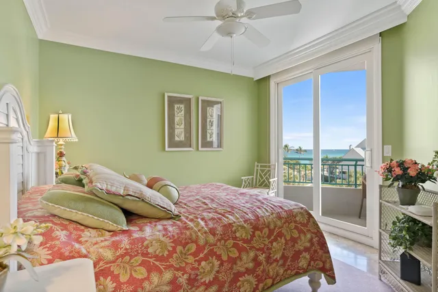 a bathroom with a granite countertop sink a toilet a mirror and shower