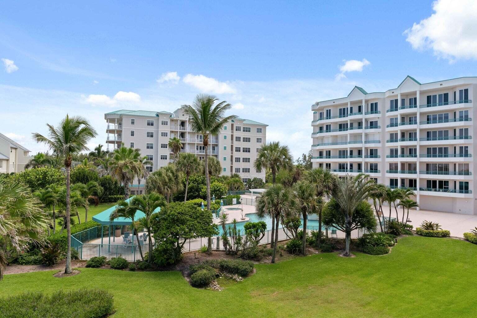 2000 Florida A1A, Unit 405 Jupiter, FL 33477 - Photo 24 of 39 a view of a building with a garden