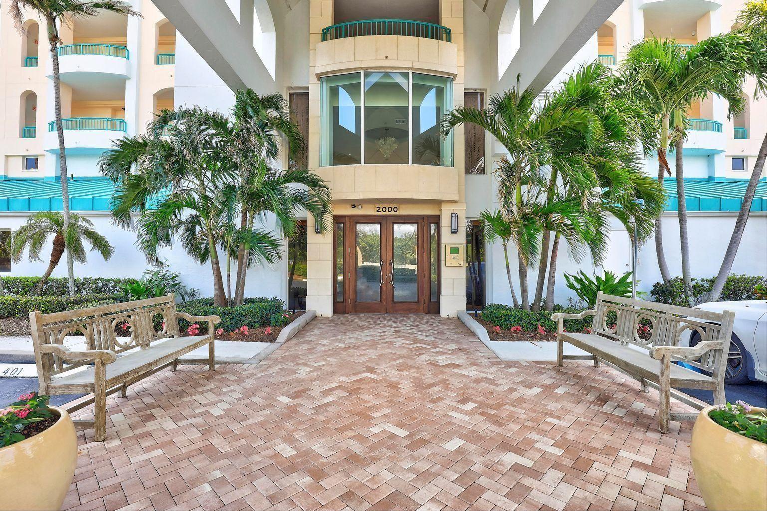 2000 Florida A1A, Unit 405 Jupiter, FL 33477 - Photo 3 of 39 a view of house with outdoor space and swimming pool