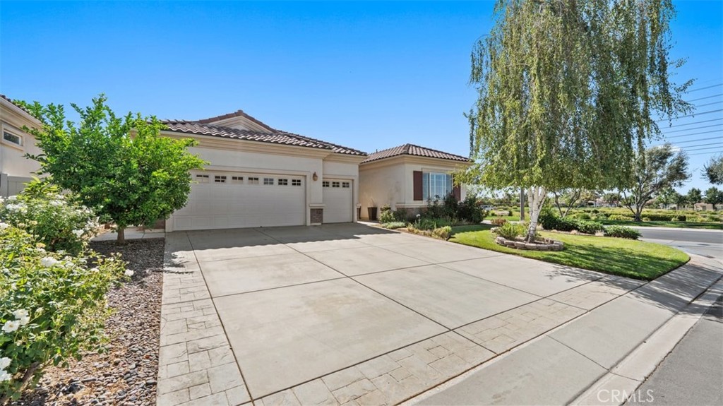 1706 Brittney Road Beaumont, CA 92223 - Photo 2 of 44 a front view of a building with garden