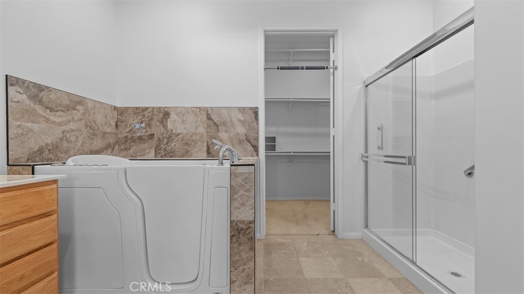 1706 Brittney Road Beaumont, CA 92223 - Photo 21 of 44 a view of a storage & utility room with washer and dryer