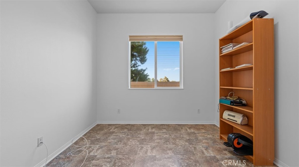 1706 Brittney Road Beaumont, CA 92223 - Photo 24 of 44 a view of an empty room and shelves