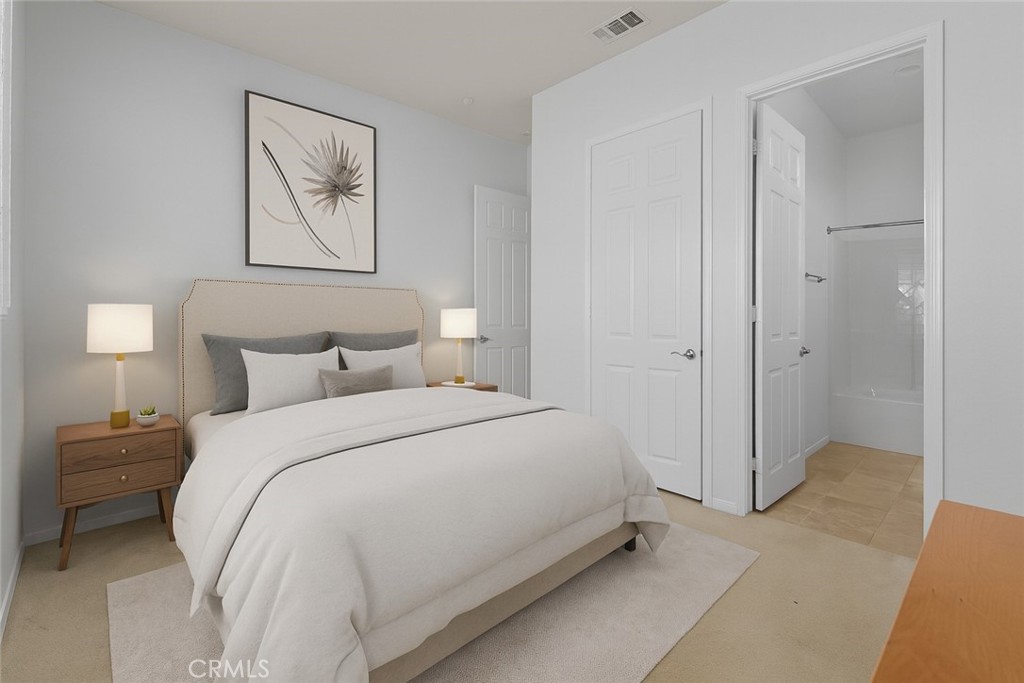 1706 Brittney Road Beaumont, CA 92223 - Photo 26 of 44 a bedroom with a bed and a painting on the wall