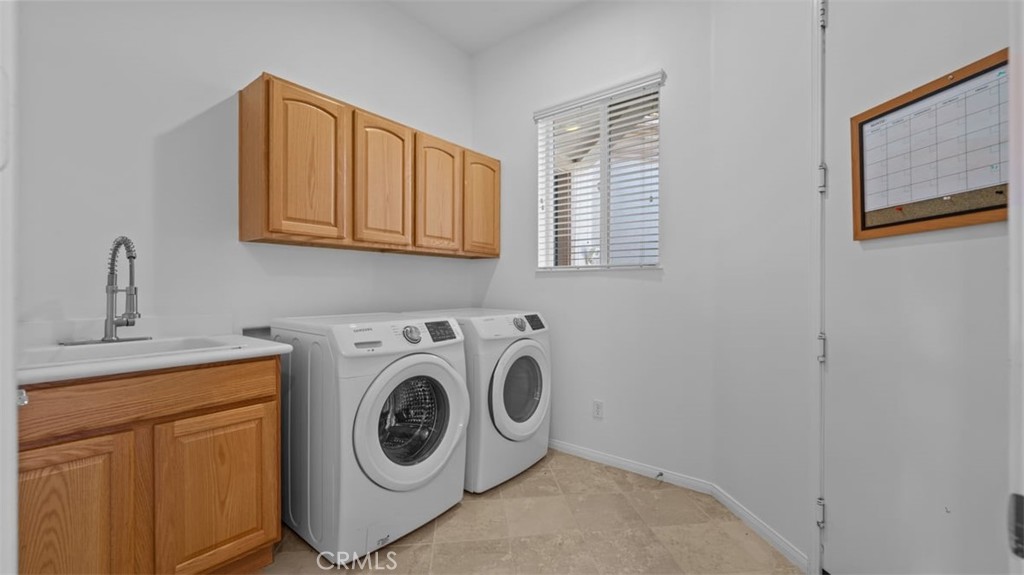 1706 Brittney Road Beaumont, CA 92223 - Photo 30 of 44 a utility room with sink dryer and washer