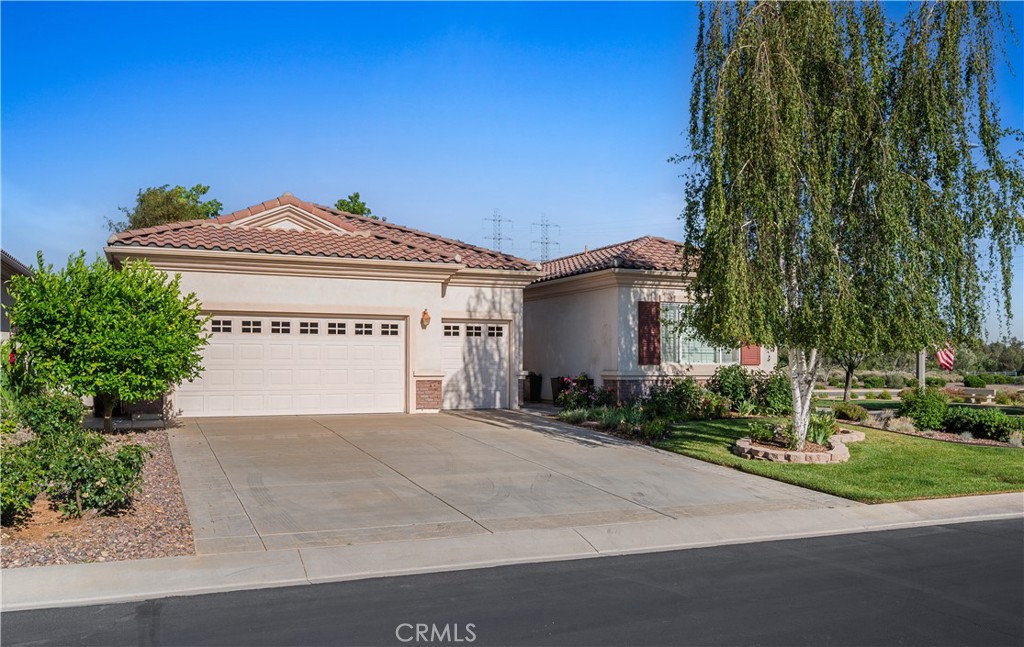 1706 Brittney Road Beaumont, CA 92223 - Photo 3 of 44 a view of a house with a yard