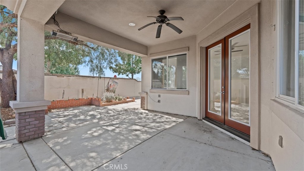 1706 Brittney Road Beaumont, CA 92223 - Photo 32 of 44 a bedroom with a large bed and a window