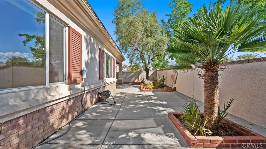 1706 Brittney Road Beaumont, CA 92223 - Photo 34 of 44 a view of house with backyard and sitting area