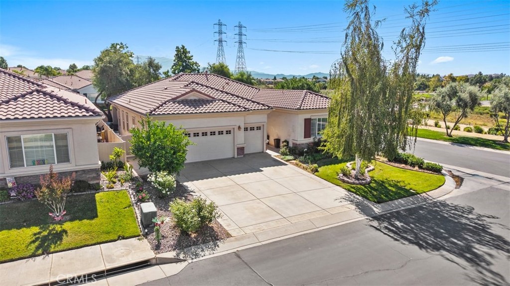 1706 Brittney Road Beaumont, CA 92223 - Photo 37 of 44 front view of a house with a garden