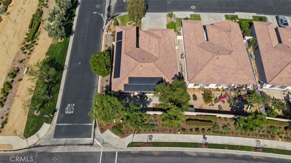1706 Brittney Road Beaumont, CA 92223 - Photo 38 of 44 an aerial view of a house with a yard and large tree