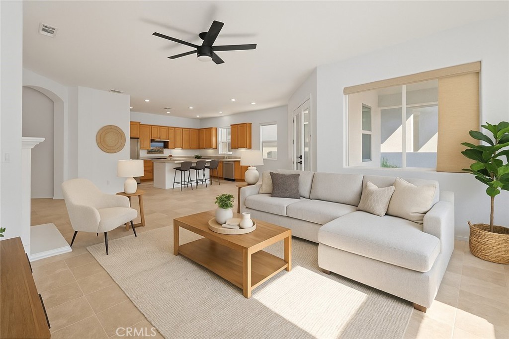 1706 Brittney Road Beaumont, CA 92223 - Photo 5 of 44 a living room with furniture kitchen view and a large window