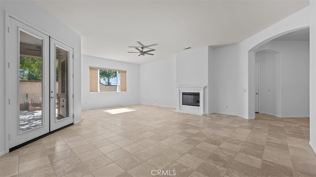 1706 Brittney Road Beaumont, CA 92223 - Photo 8 of 44 a view of a livingroom with a fireplace and window